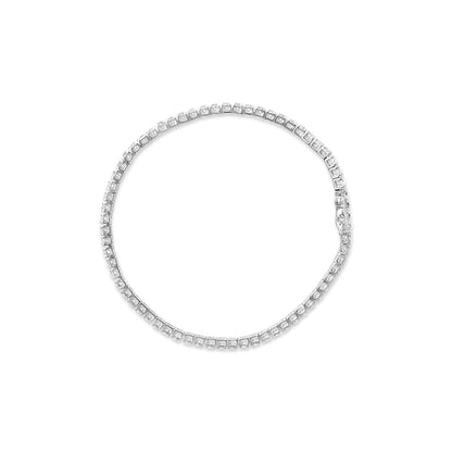 Top-down view of a white metal bracelet featuring round white gemstones in 4-prong settings arranged in a continuous circle.