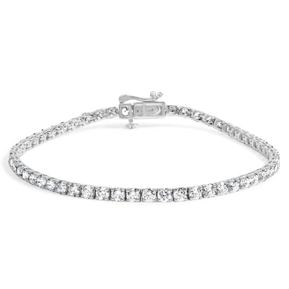 White metal bracelet with two sizes of round white gemstones in 4-prong settings, shown from front angle.