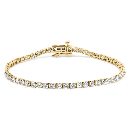 Yellow metal bracelet with round white gemstones in 4-prong settings, shown from a front angled perspective.