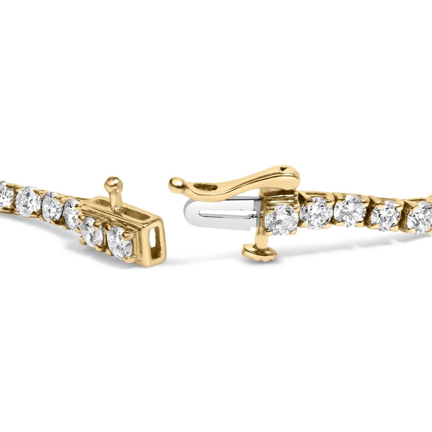 Close-up angled view of a yellow metal bracelet with a clasp, set with round white gemstones in four-prong settings.