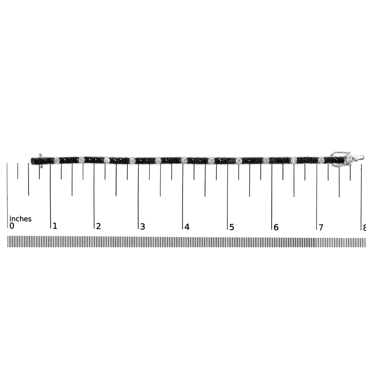 White metal bracelet with alternating round white and black gemstones in four-prong settings, laid flat on a ruler for size reference, side view.