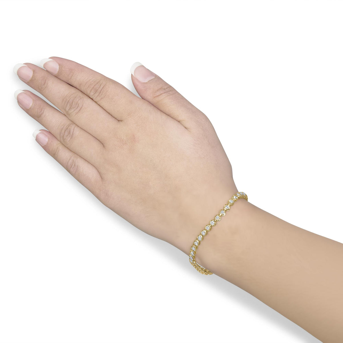 Close-up angled shot of a model wearing a yellow bracelet featuring round white gemstones in prong settings.
