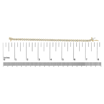 Yellow bracelet with round white gemstones in prong settings, displayed flat on a measuring scale, top-down view.