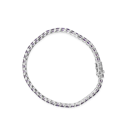 Top-down view of a white metal bracelet with round purple gemstones in 4-prong settings linked together in a continuous circle.