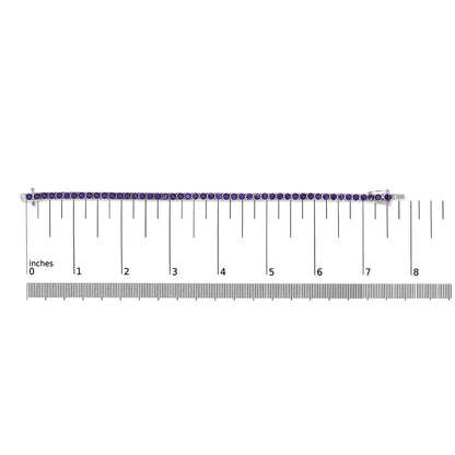 Straight-on shot of a white metal bracelet with round purple gemstones in 4-prong settings, placed on a ruler for size reference.