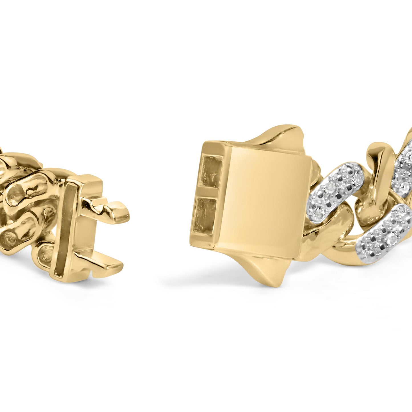 Close-up of a yellow metal bracelet clasp with linked segments, some featuring white round gemstones in prong settings, shot from a side angle.