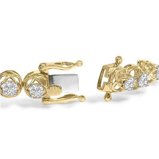 Close-up front angle of a yellow metal bracelet with round white gemstones in prong settings, showing the clasp mechanism.