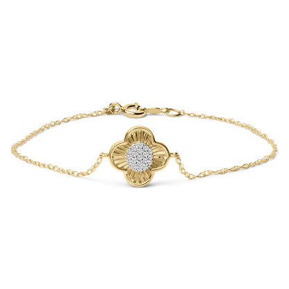 Close-up front view of a yellow bracelet with a chain and a flower-shaped centerpiece adorned with white round gemstones in prong settings.