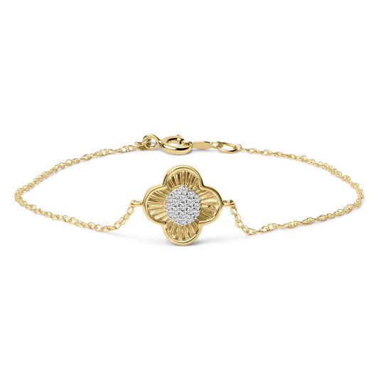 Close-up front view of a yellow bracelet with a chain and a flower-shaped centerpiece adorned with white round gemstones in prong settings.