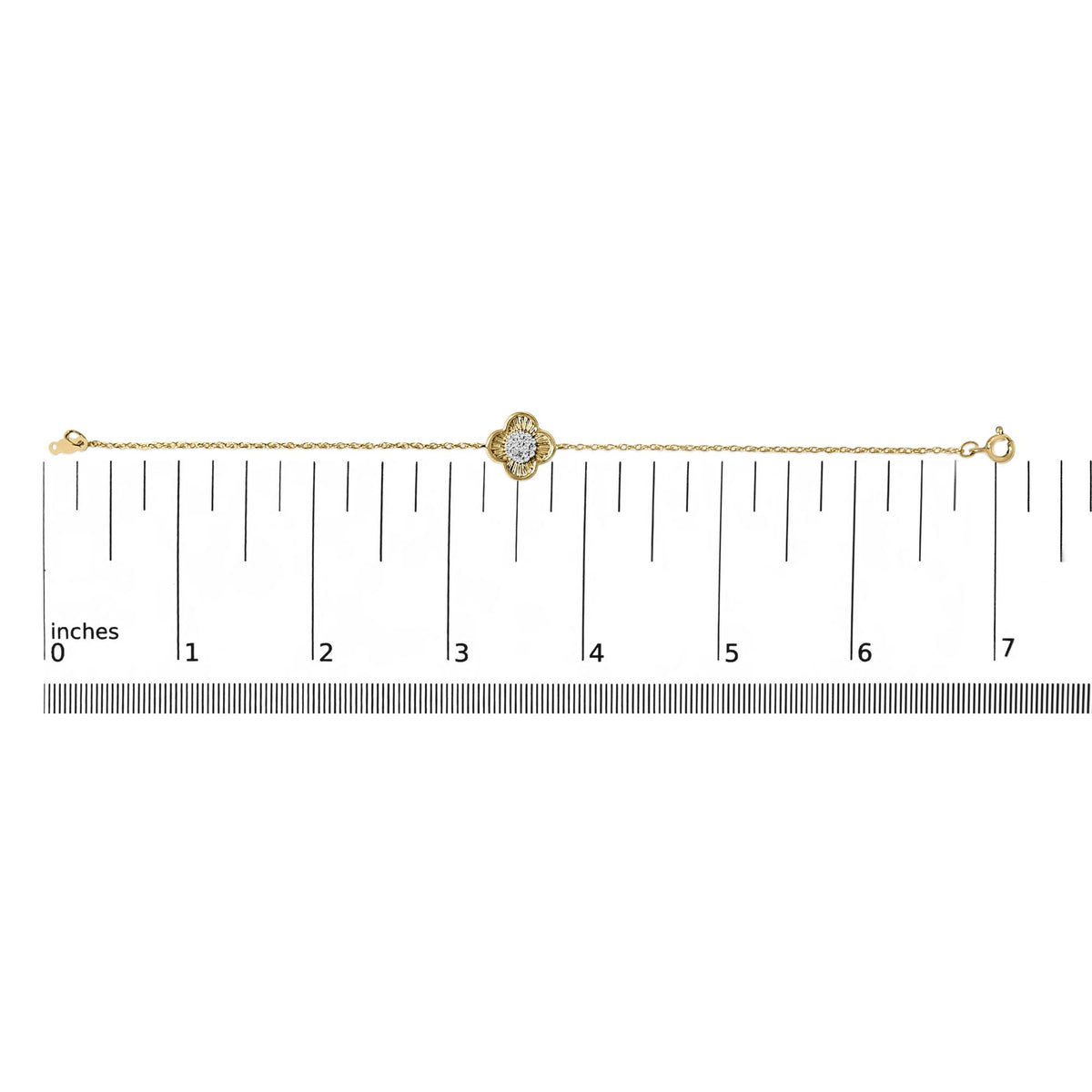 Yellow bracelet with a flower-shaped centerpiece featuring white round gemstones in prong settings, shown lying flat on a scale, front view.