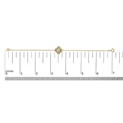 Yellow bracelet with a flower-shaped centerpiece featuring white round gemstones in prong settings, shown lying flat on a scale, front view.