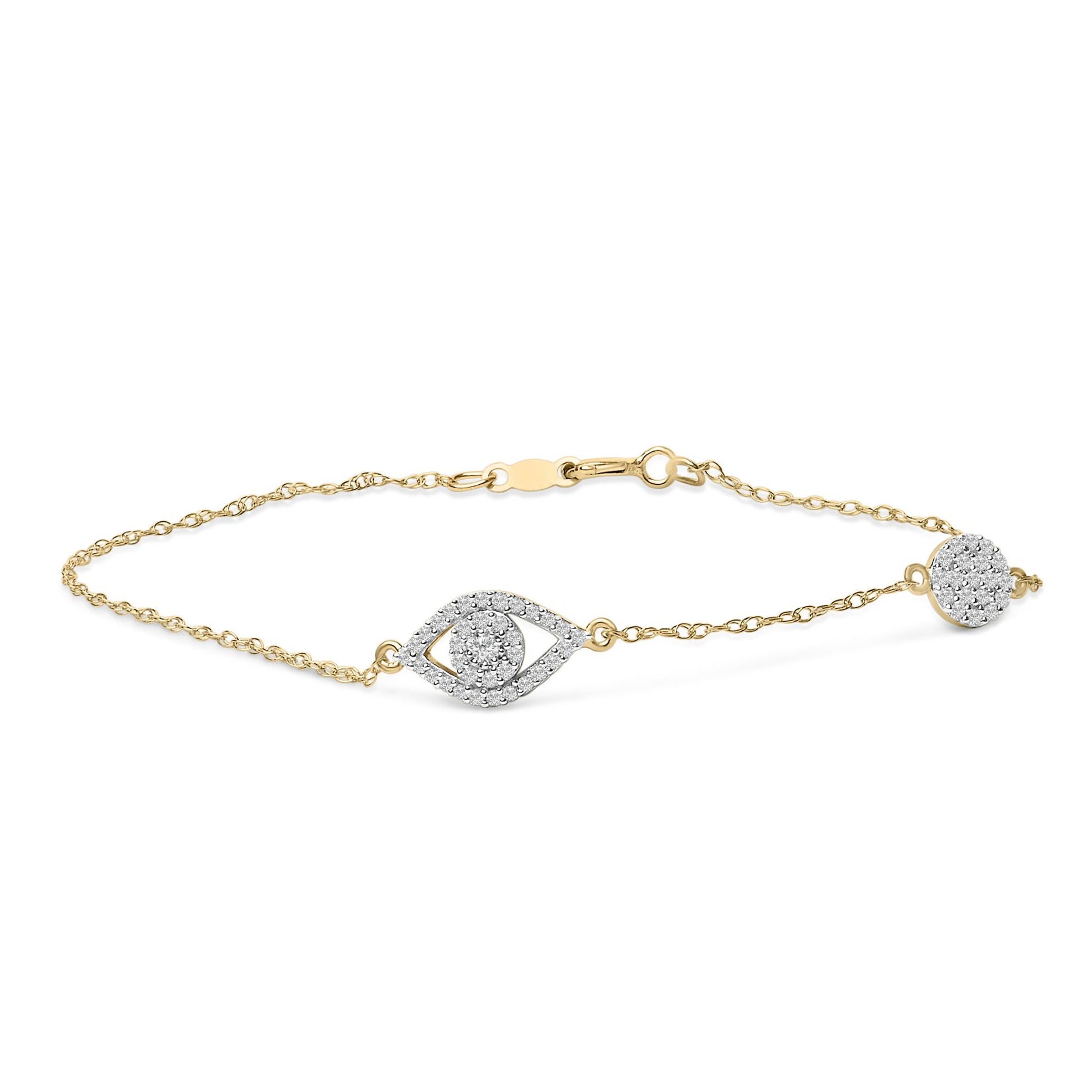 Close-up front angle of a yellow metal bracelet with a chain and a central eye-shaped design set with small round white gemstones, shown on a white background.