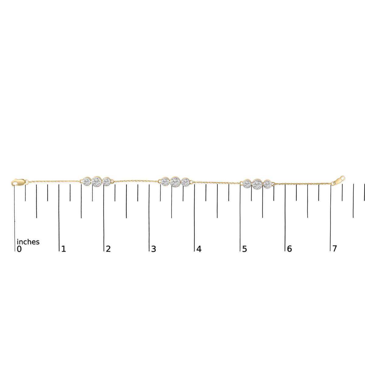 Yellow metal bracelet with sections of round white gemstones in prong settings, shown flat on a measurement scale, top-down angle.