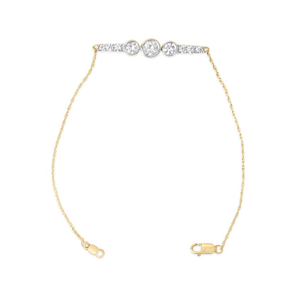 Yellow bracelet with a delicate chain, featuring a bar centerpiece with small white gemstones and three larger round white gemstones in the center, shown flat against a white background from a top-down angle.