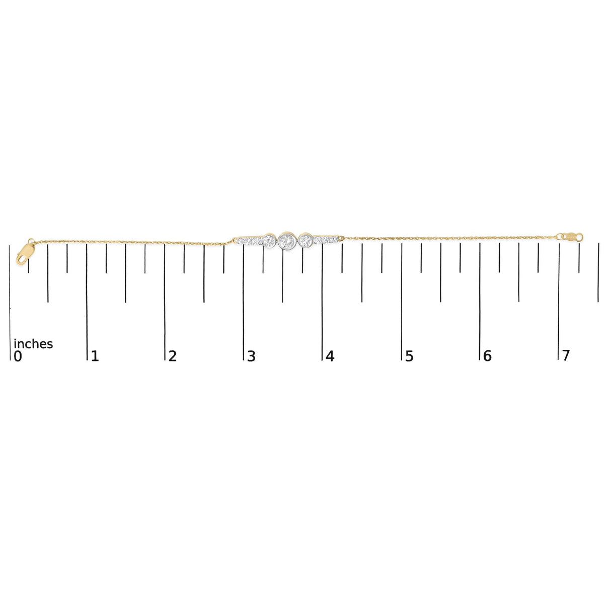Yellow metal bracelet with a central cluster of round white gemstones in prong settings, shown flat on a scale with a straight-on angle.