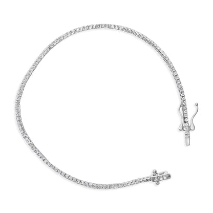 Close-up front angle of a white bracelet with a continuous row of round white gemstones in prong settings, shown laid flat with clasp visible.