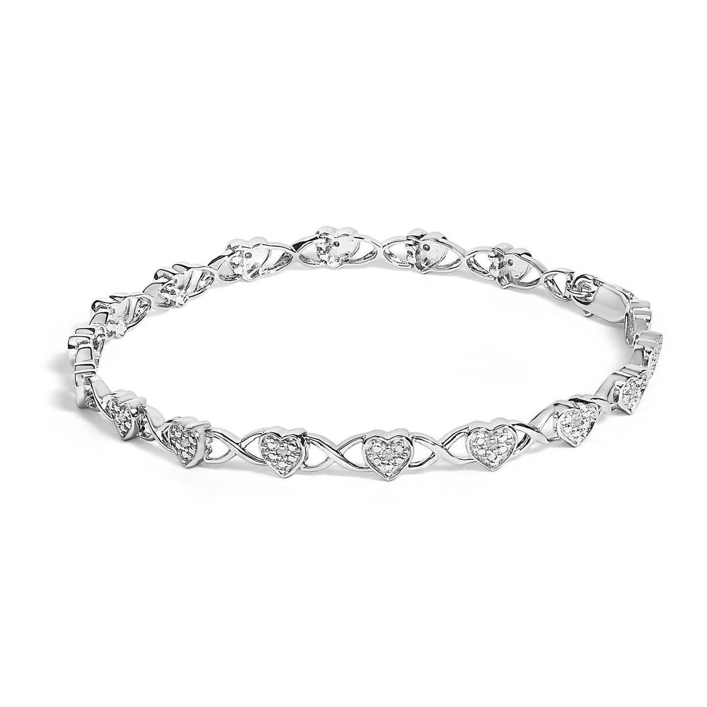 White metal bracelet with heart-shaped links featuring prong-set round white gemstones, shown at a slight angle on a white background.