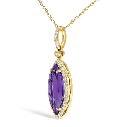 Close-up front angle of a yellow metal necklace pendant with a marquise-shaped purple gemstone surrounded by small white gemstones in a micro-pave setting.