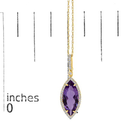 Close-up front view of a yellow metal necklace with a marquise-shaped purple gemstone pendant surrounded by white round gemstones in a micro-pave setting, shown on a scale.