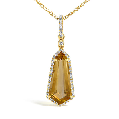 Close-up front view of a yellow necklace pendant with a large trapezoid yellow gemstone prong set in the center, surrounded by a border of small round white gemstones in micro-pave setting, hanging from a yellow chain also accented with small round white gemstones in micro-pave setting.