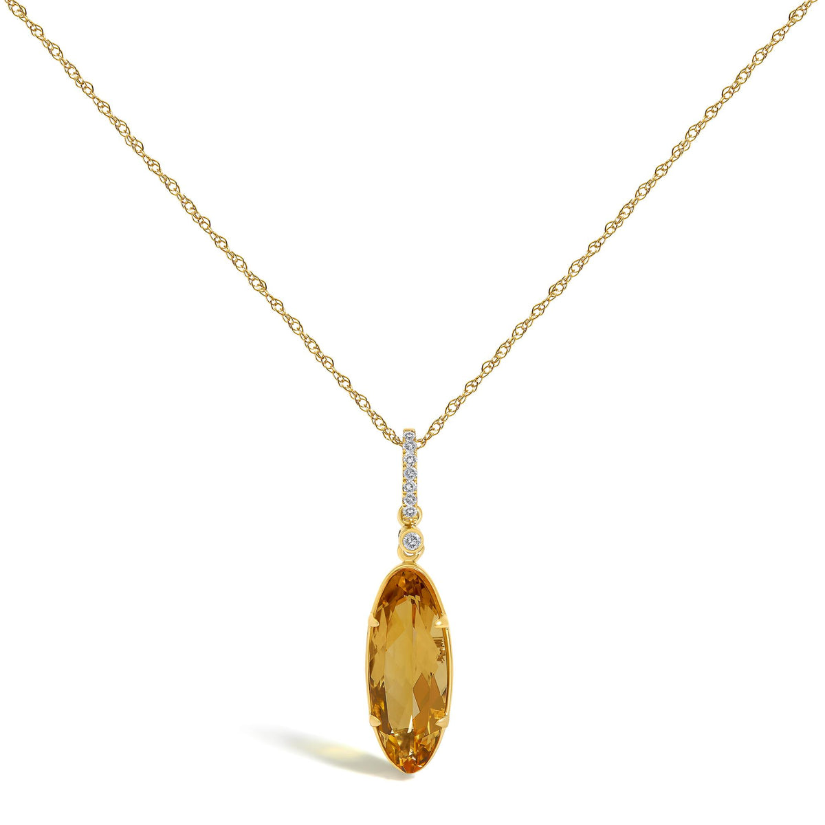 Yellow metal necklace shown front-facing on a white background with a vertical drop pendant featuring oval yellow gemstone at the bottom and small round white gemstones in a micro-pave setting above it.