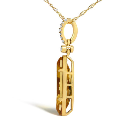 Close-up angled side view of a yellow necklace pendant with a row of small round white gemstones in a micro-pave setting along the top loop and a single yellow oval gemstone in a prong setting.
