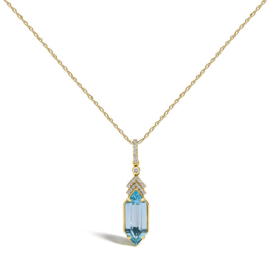 Close-up front view of a yellow metal necklace with a pendant featuring multiple small white gemstones in micro-pave setting and one large blue gemstone in a prong setting.