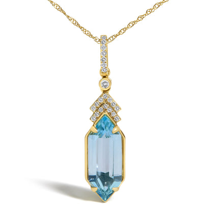 Close-up front view of a yellow metal necklace with a vertical pendant featuring small round white gemstones in micro-pave setting, a round white gemstone in a bezel setting, and a blue gemstone with a prong setting at the bottom.