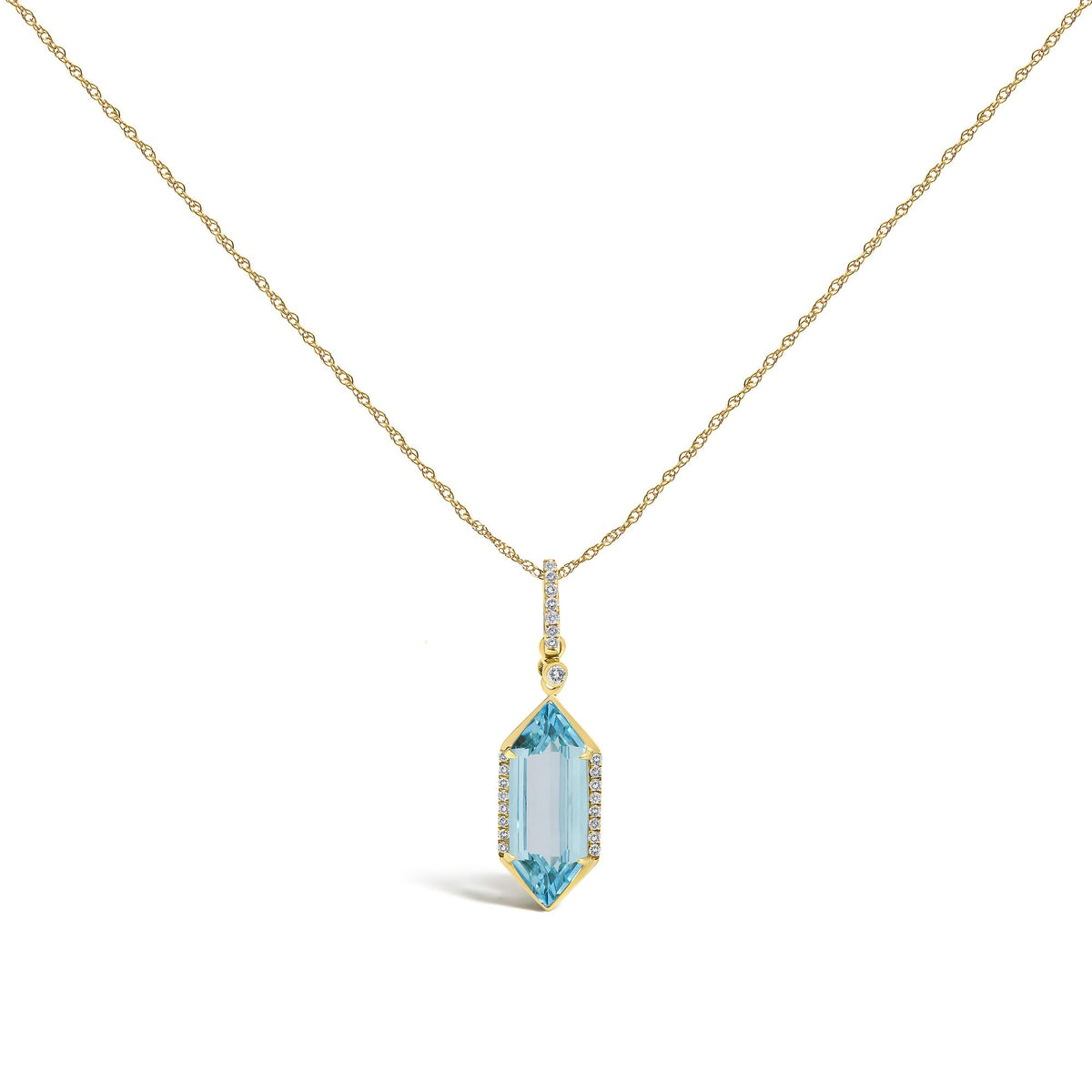Close-up front angle of a yellow necklace with a vertical pendant. The pendant features a row of small white gemstones in a micro-pave setting and a larger elongated blue gemstone with a prong setting, also accented with small white gemstones. The necklace is shown on a white background.