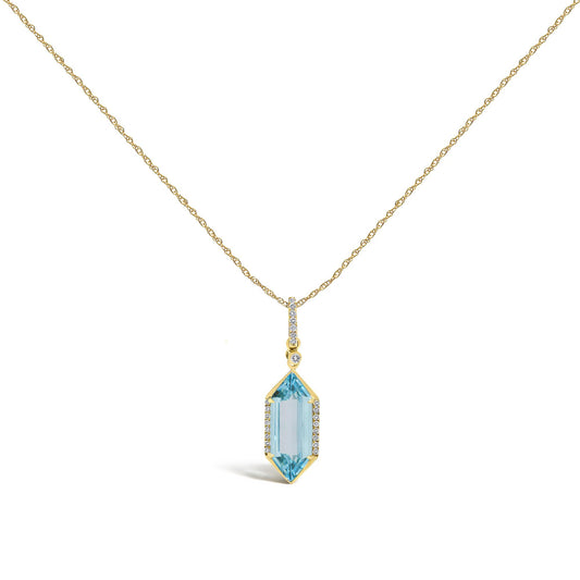 Close-up front angle of a yellow necklace with a vertical pendant. The pendant features a row of small white gemstones in a micro-pave setting and a larger elongated blue gemstone with a prong setting, also accented with small white gemstones. The necklace is shown on a white background.