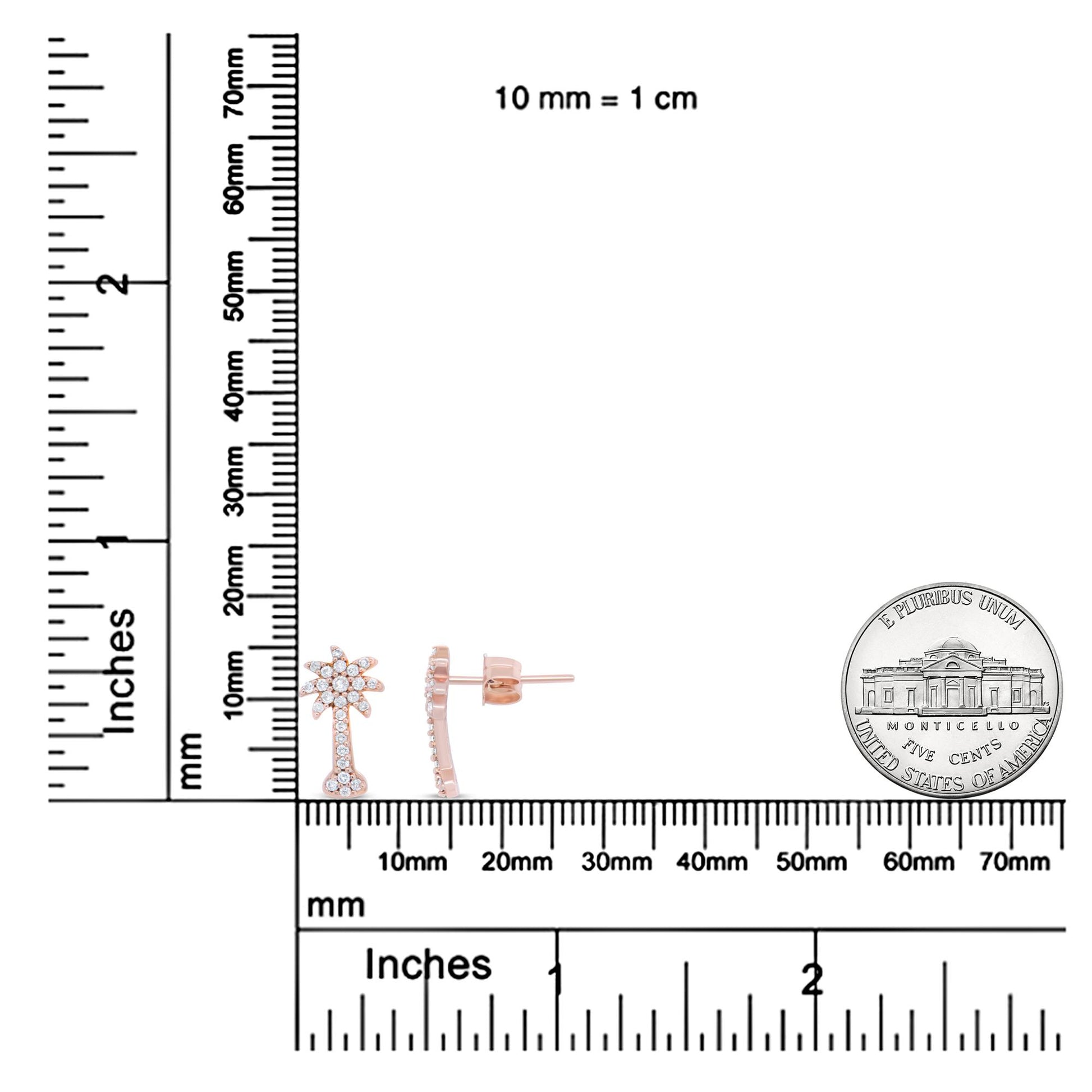 Front and side view of rose-colored metal earrings with white round gemstones in prong settings, displayed on a ruler and scale for size reference.