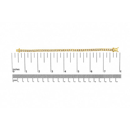 Yellow bracelet with round white gemstones in 4-prong settings, shown flat on a scale, top view.