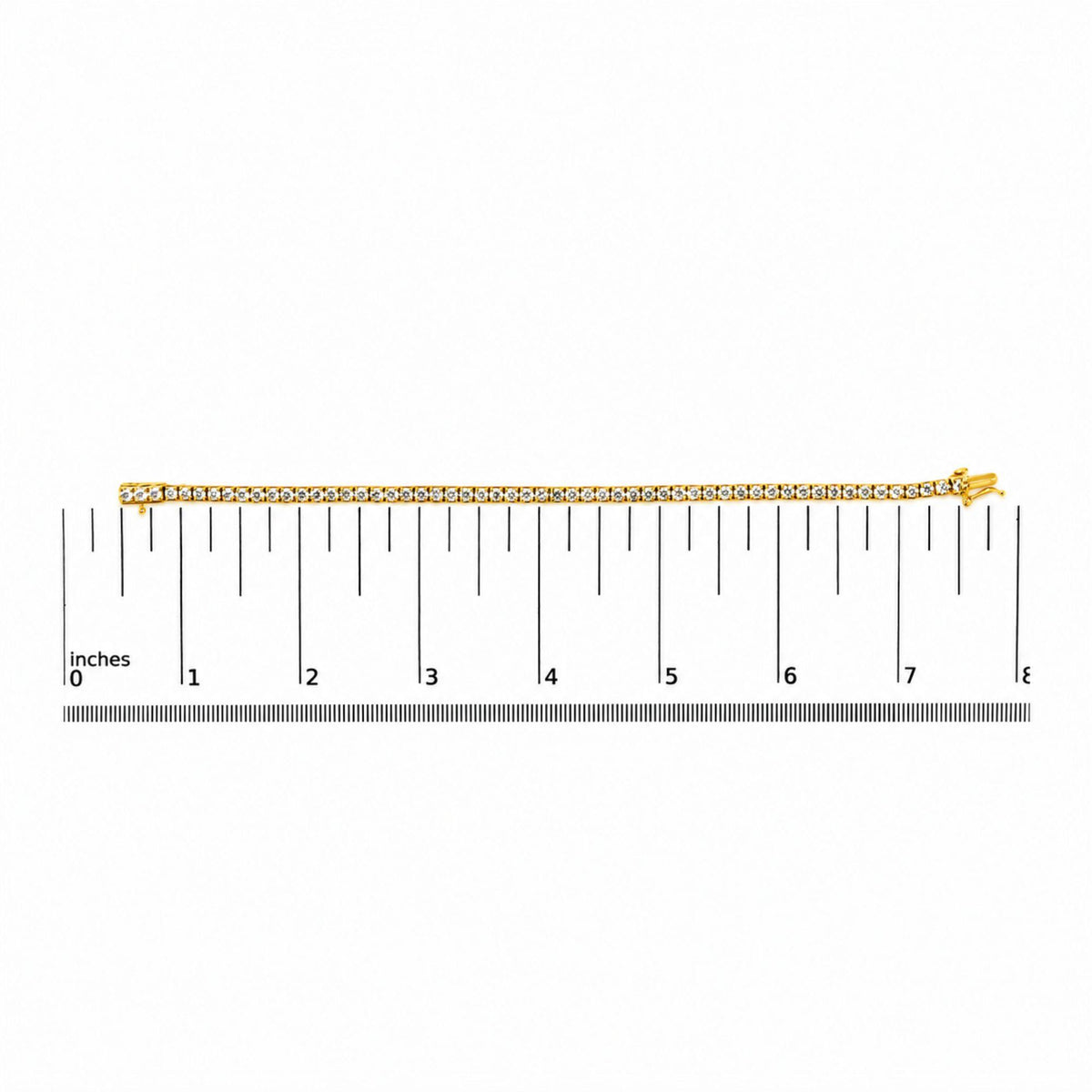 Yellow metal bracelet with round white gemstones in 4-prong settings, shown flat on a scale from a top-down angle.