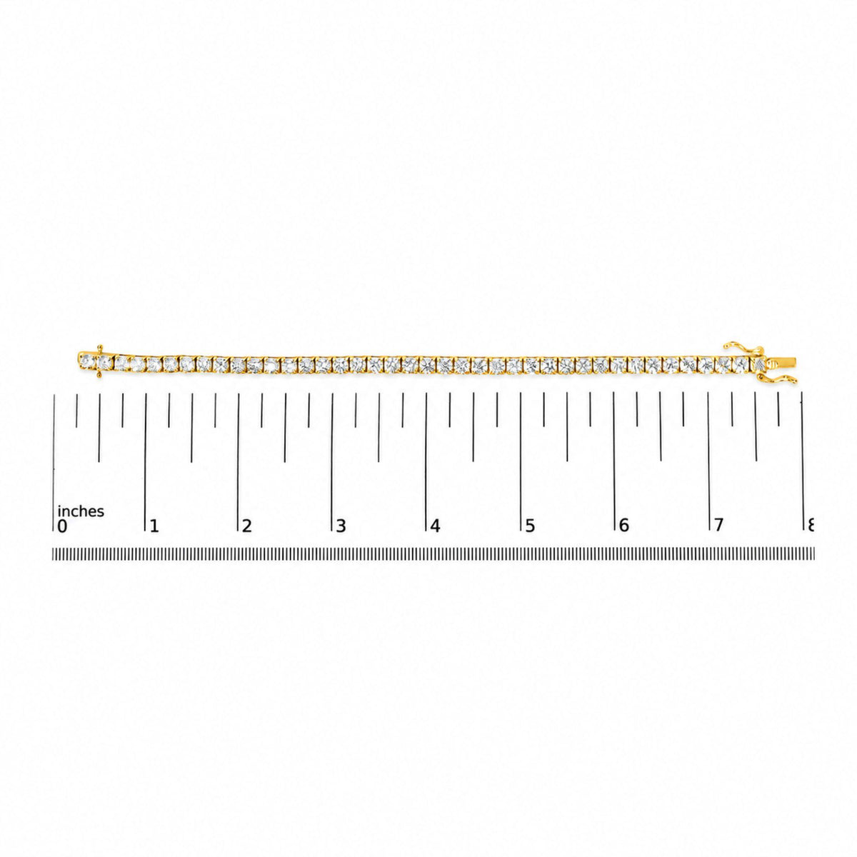 Yellow bracelet with round white gemstones in 4-prong settings shown on a flat surface next to a measurement scale, image taken from above.