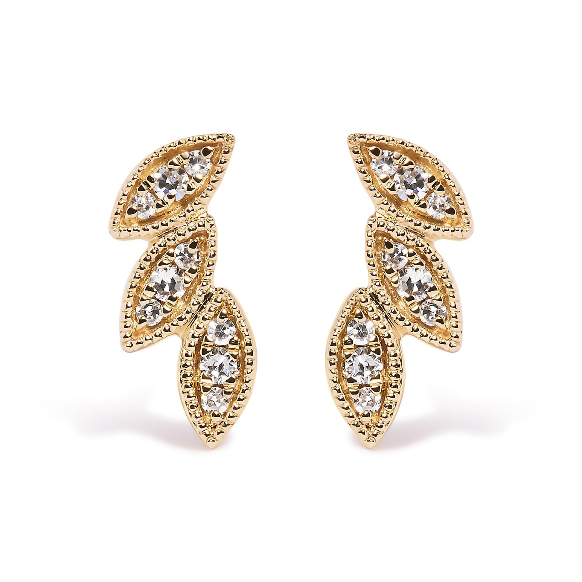 Front view of yellow metal earrings featuring three marquise-shaped segments with pave-set white round gemstones.