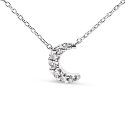 Close-up front view of a white metal necklace with a crescent-shaped pendant featuring round white gemstones in pave setting.