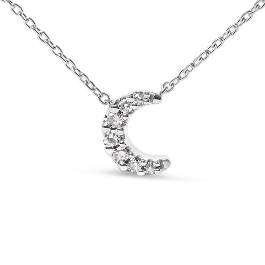 Close-up front view of a white metal necklace with a crescent-shaped pendant featuring round white gemstones in pave setting.