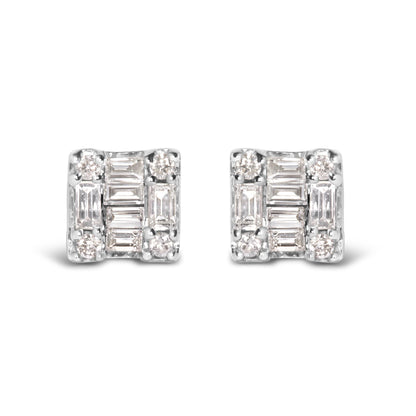 Front angle of a pair of white metal square-shaped earrings featuring white round gemstones in prong settings at the corners and white baguette-shaped gemstones in channel settings arranged in the center.