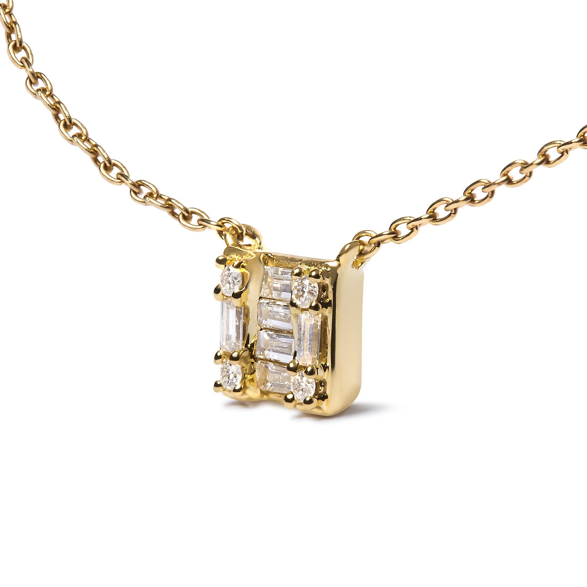 Yellow metal necklace shown in close-up front angled view with rectangular pendant featuring multiple white gemstones in baguette and round shapes with channel and prong settings.