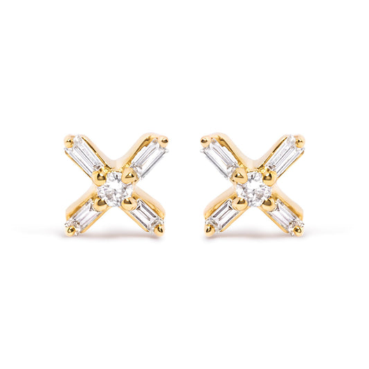 Front angle view of yellow metal earrings with a central round white gemstone and four surrounding baguette-shaped white gemstones in prong settings.