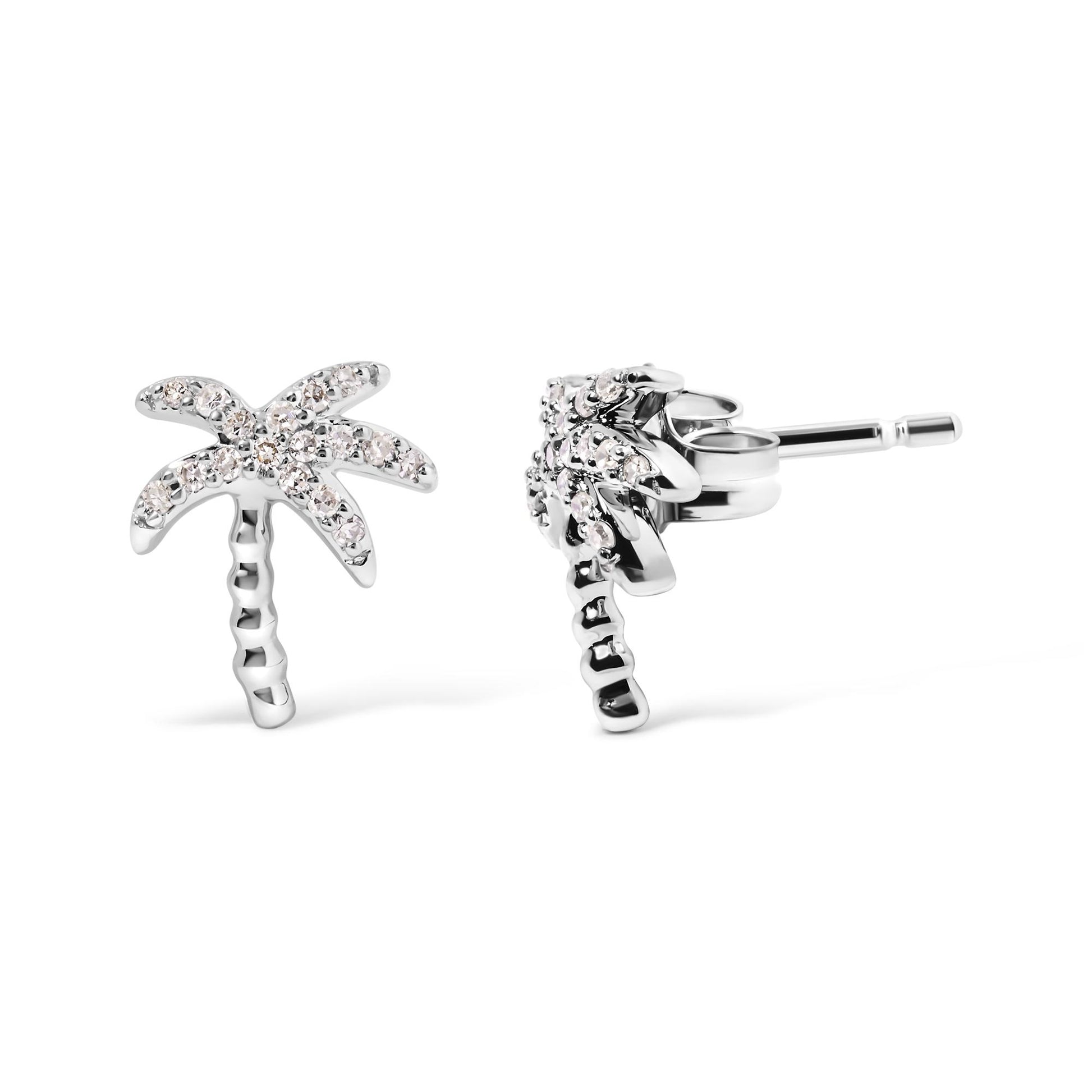 Front and side view of white metal palm tree-shaped earrings with round white gemstones in pave setting.