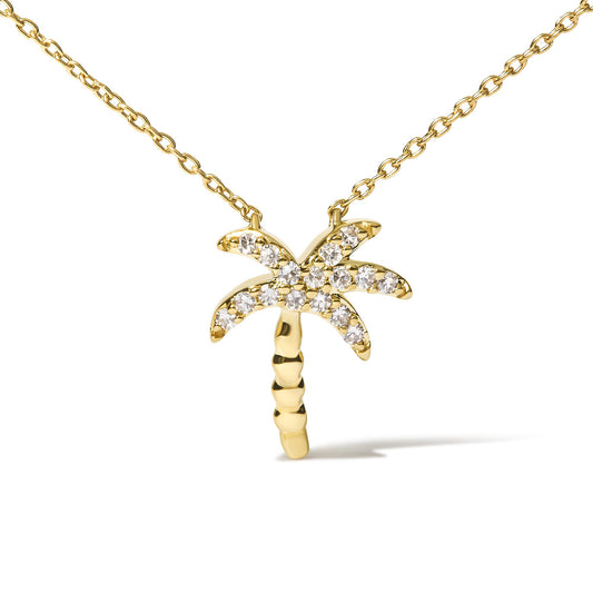 Yellow metal necklace with a palm tree-shaped pendant featuring round white gemstones in pave setting, shown from the front on a white background.