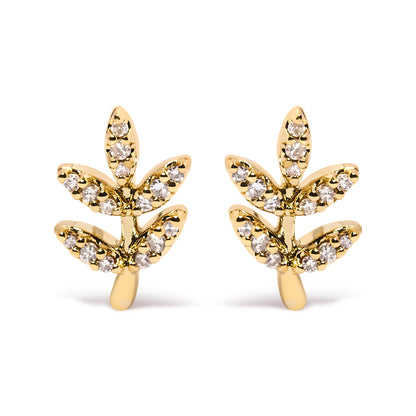Front angle view of a pair of yellow metal earrings shaped like branches with leaves, each leaf adorned with round white gemstones in pave setting.