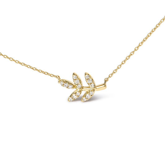 Yellow metal necklace with a leaf-shaped pendant adorned with round white gemstones in pave settings, shown in a close-up front angle.