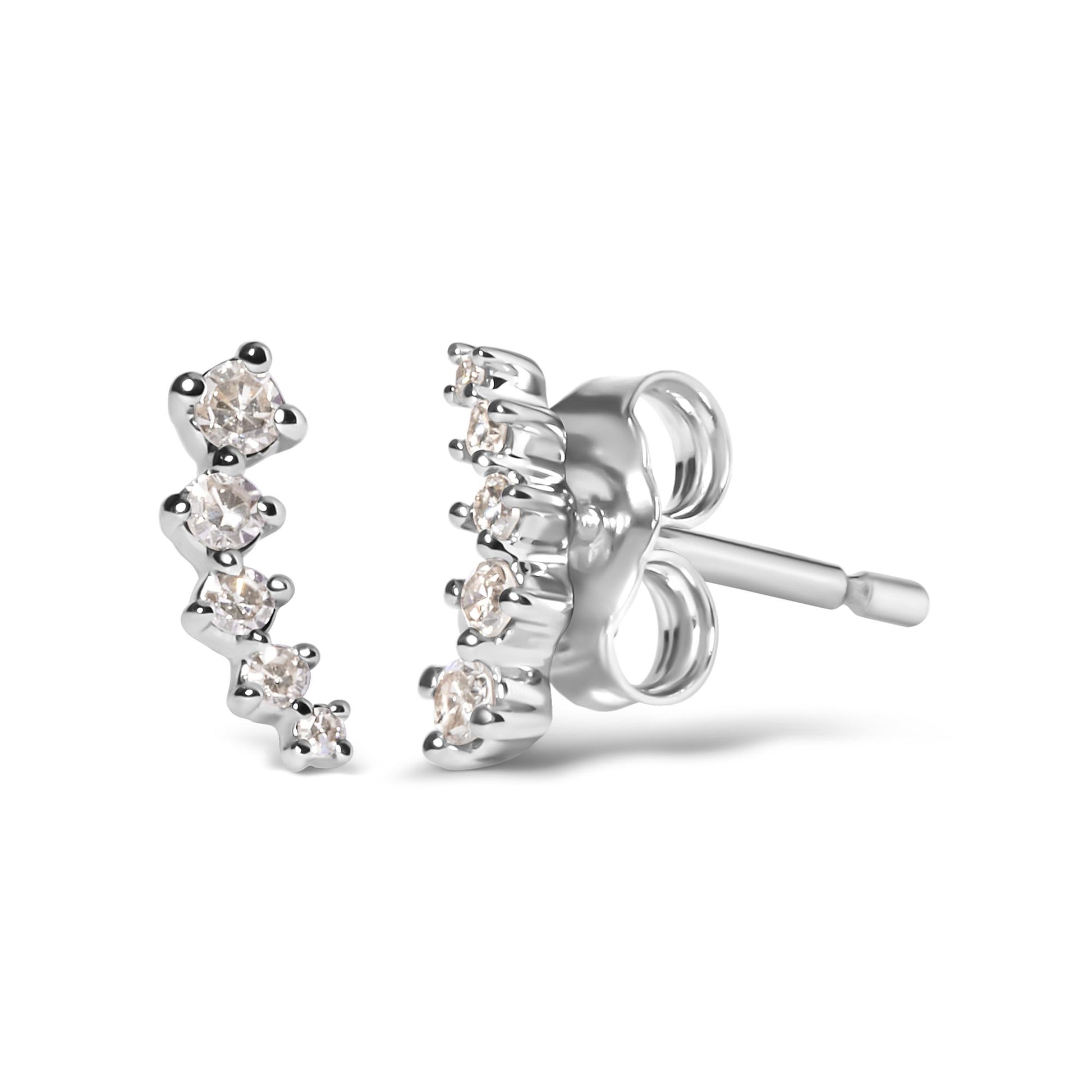 Close-up front and side angle of white metal earrings with a curved row of round white gemstones in prong settings.