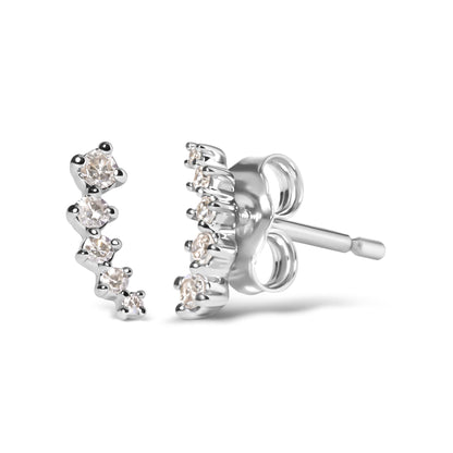Close-up front and side angle of white metal earrings with a curved row of round white gemstones in prong settings.