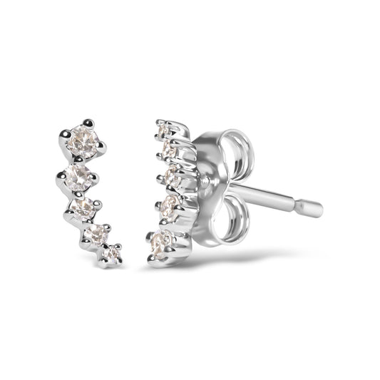 Close-up front and side angle of white metal earrings with a curved row of round white gemstones in prong settings.
