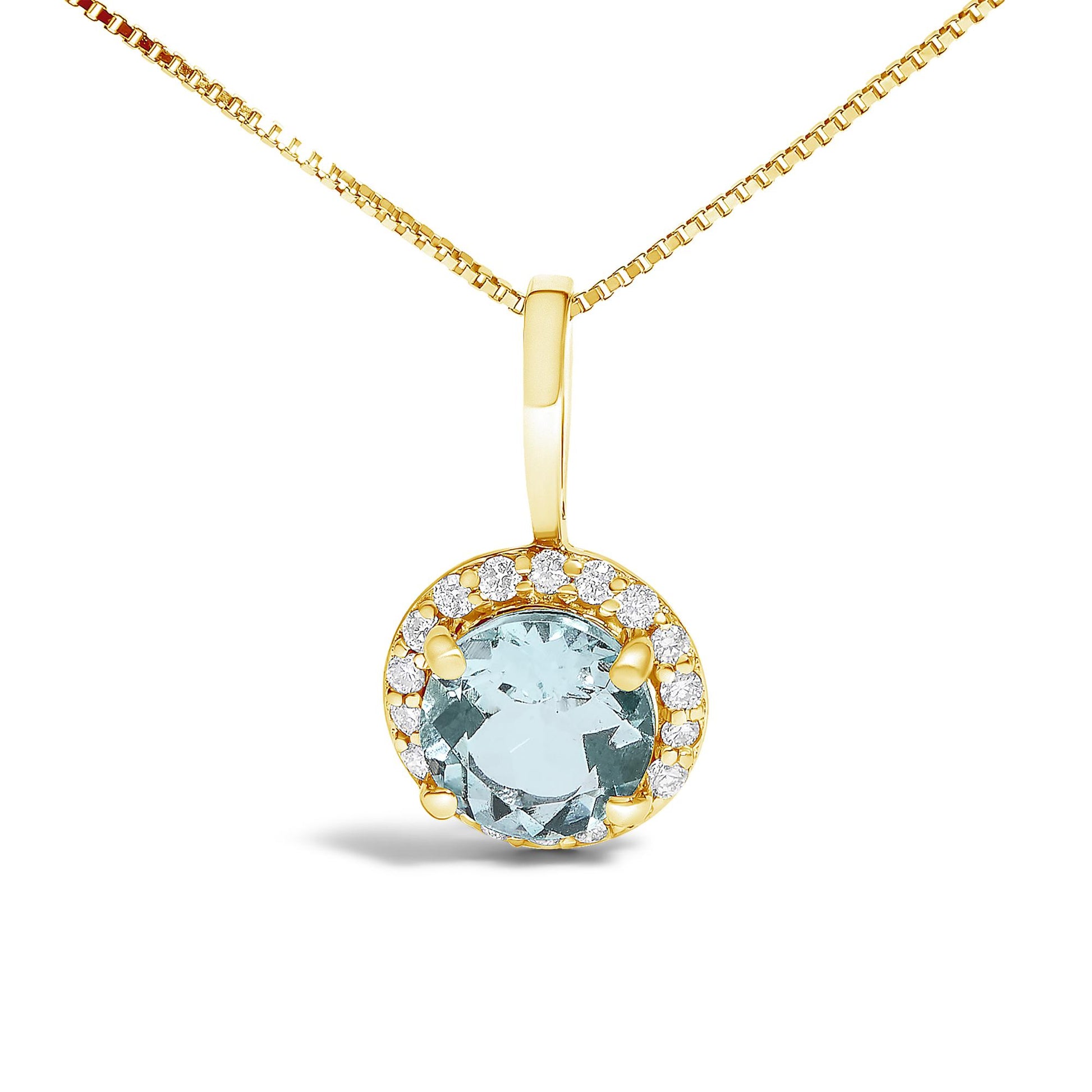 Close-up front view of a yellow metal necklace pendant featuring a round blue gemstone in a four-prong setting, surrounded by a halo of round white gemstones in a shared prong setting.