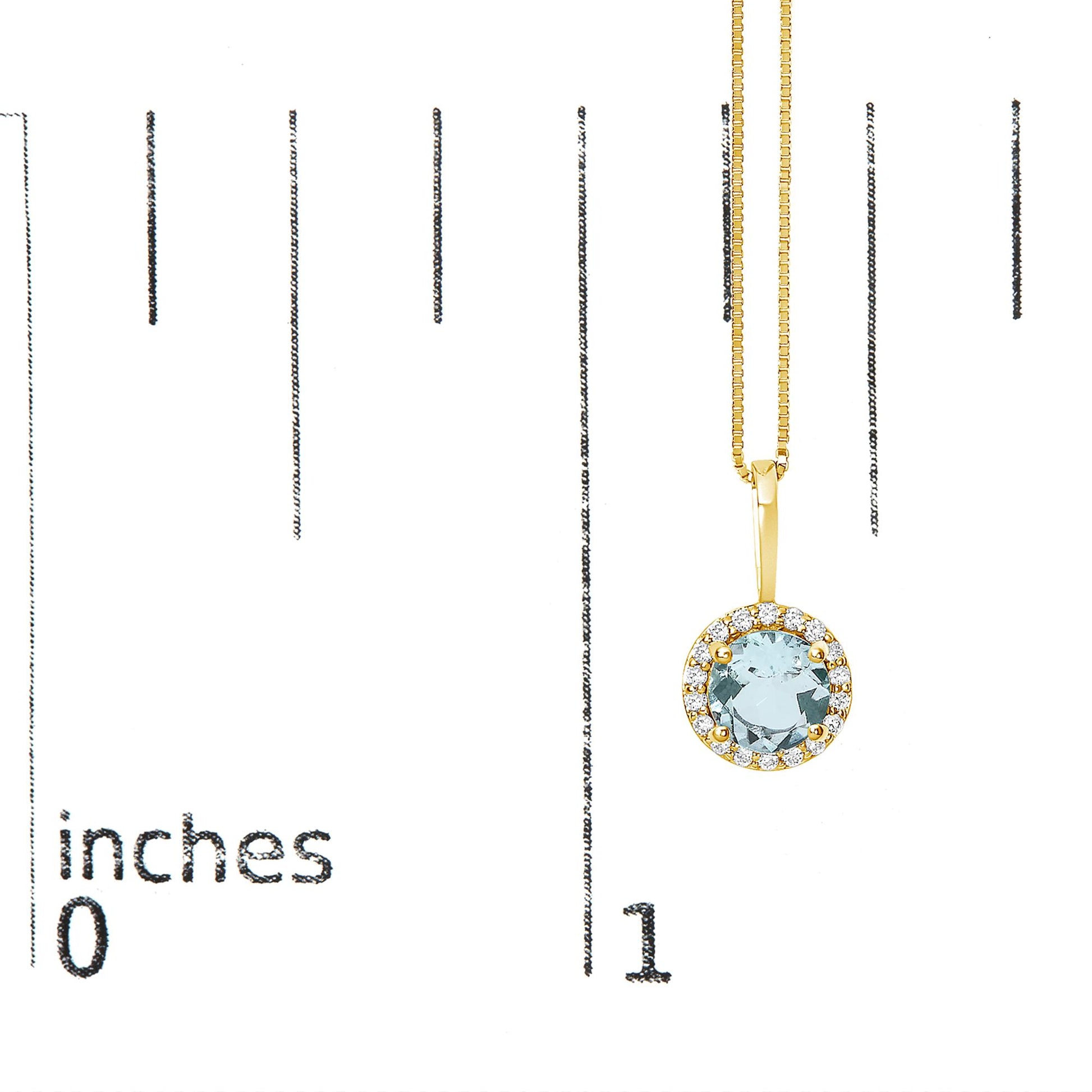 Yellow metal necklace with a round blue gemstone pendant surrounded by small white gemstones, shown hanging on a scale at a slight angle.