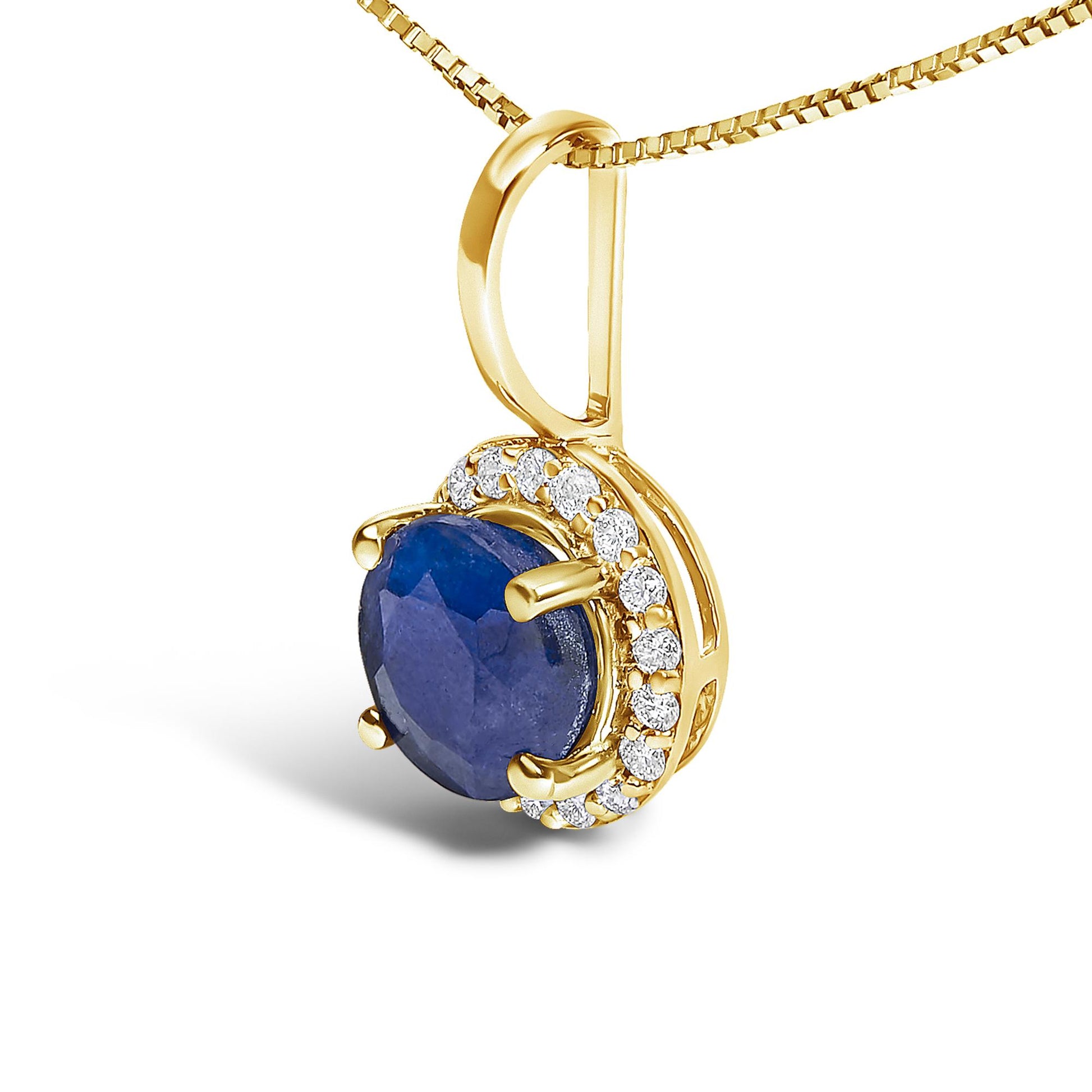 Close-up front angle of a yellow necklace pendant featuring a round blue gemstone in a four-prong setting, surrounded by a halo of small round white gemstones in a shared prong setting.